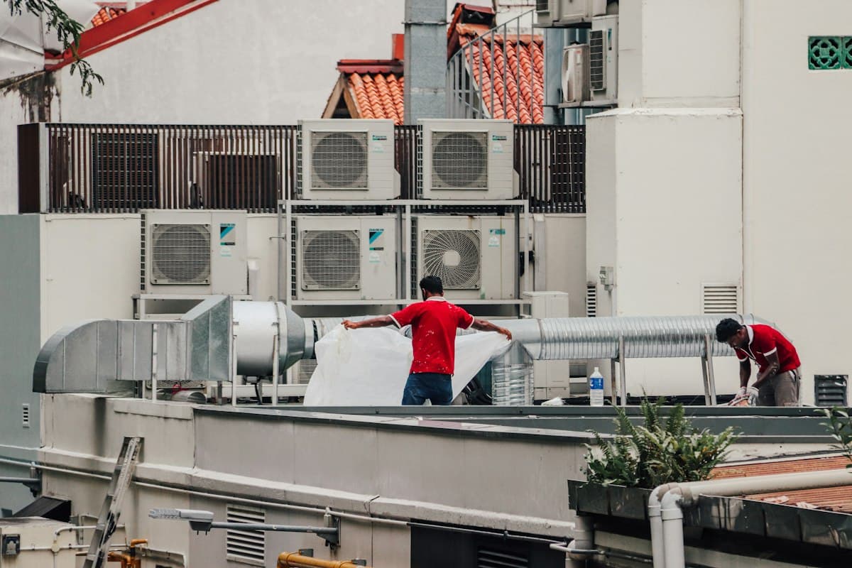 HVAC technician servicing a residential air conditioning unit